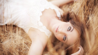 Woman haybale white dress portrait - a hay bale free wallpaper