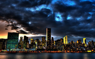 City skyline cloudy evening moon - city background free wallpaper
