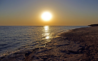 Beach sunset mountain ocean moon - a small island in the distance free wallpaper