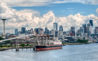 Large boat city skyline clouds - tall free wallpaper