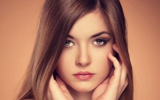 Woman long hair brown background - shaded free wallpaper