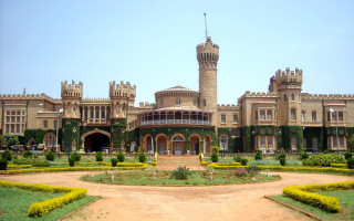 Large building clock tower garden - front view free wallpaper
