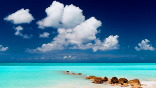 Beach rocks water cloudy sky 2 - rock and water under a cloudy sky free wallpaper
