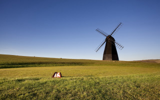 Windmill field person tiltshift sunset 2 - a windmill in a field free wallpaper