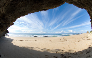 Beach view cave sunny day - a view of a beach free wallpaper