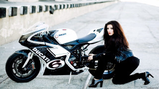Woman sitting motorcycle street helmet - her knee free wallpaper