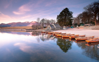 Lake sunset mountains boats arts - the shore of a lake free wallpaper