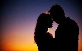 Sunset couple silhouette romantic backlighting - a couple free wallpaper