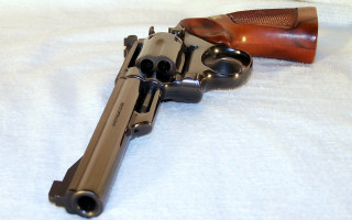 Gun wooden case white background - a white sheet free wallpaper