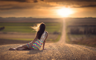 Girl sitting road sunset blowing - the side of a road free wallpaper