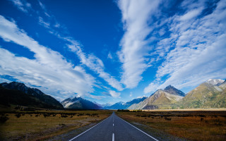 Long road clouds mountains blue - a sky free wallpaper