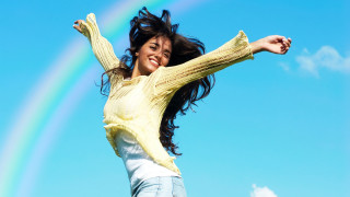 Cheerful woman jumping rainbow blue - cheerful free wallpaper