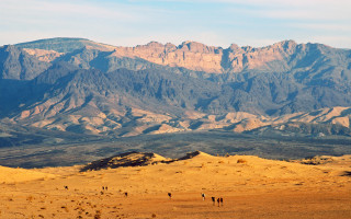 Desert mountains cloudy sky shore - the background and a sky free wallpaper