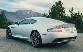 Silver sports car mountains clouds 2 - a parking lot free wallpaper