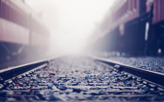 Train track foggy sky tiltshift - a foggy sky in the background free wallpaper