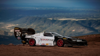Car mountains dirt road sunset - a number free wallpaper