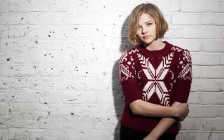 Woman red sweater white brick - against free wallpaper