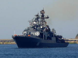 Large ship smoke masts small - a smaller boat in the background free wallpaper
