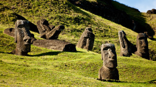 Carved heads forest grassy hill - facial feature free wallpaper