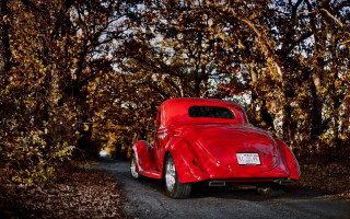 Red car parked woods person - a red car free wallpaper