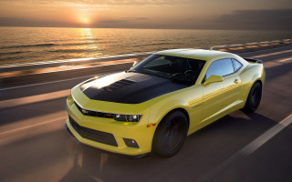 Yellow car ocean road sunset - a road near the ocean free wallpaper
