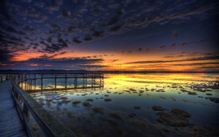 Pier sunset clouds water rocks 2 - a pier free wallpaper