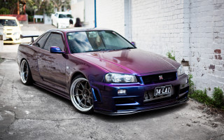 Purple car brick wall parking - a purple car free wallpaper