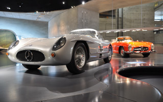 Car museum display mirror vorticism - a car in the background free wallpaper