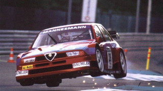 Red car jumping barrier race - a race track free wallpaper