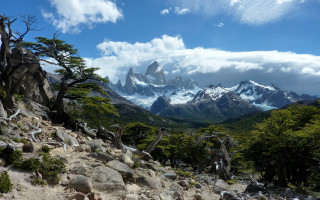 Mountain range trees rocks clouds - a matte painting free wallpaper