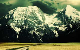 Mountain road cloudy sky night - a road in front free wallpaper
