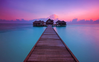 Pier houses ocean sunset pastel - sky in the background free wallpaper