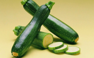 Cucumbers slices yellow background synthetism - a yellow background behind them free wallpaper