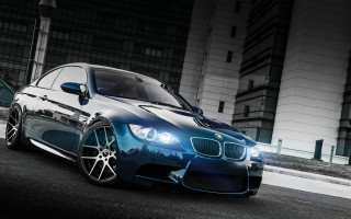 Blue car road building night - a black car free wallpaper