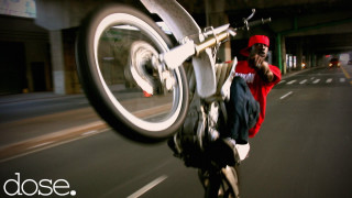 Man riding bike street building - a street next free wallpaper