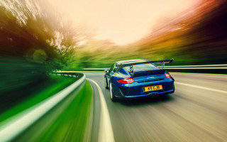 Blue sports car driving road 11 - a blue sports car free wallpaper