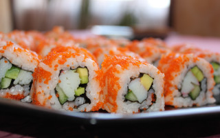 Sushi cucumbers sauce tablecloth blurry - a plate of sushi free wallpaper