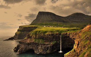 Mountain waterfall boat sunset cloudy - a large mountain free wallpaper