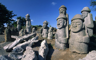 Statues rocks trees sky nature - top of a field free wallpaper