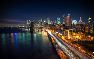 City skyline night bridge river 13 - a city skyline in the background free wallpaper