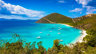 Beach boats mountain clouds sky 2 - the water and a mountain in the background free wallpaper