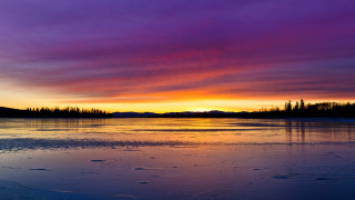 Sunset lake footprints purple sky - a sunset over a lake free wallpaper