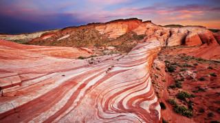 Large rock formation sunset mountains - the foreground and a mountain in the background free wallpaper