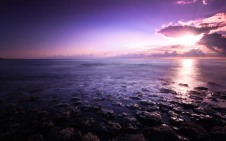 Purple sky beach water mountains - rock and water free wallpaper