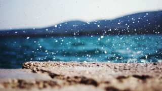Water splash beach mountains sky - a beach near the ocean free wallpaper