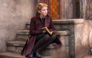 Woman sitting outside reading book - movie still free wallpaper