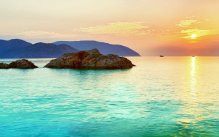 Lake rock sunset mountains beach - a rock in the middle of it free wallpaper