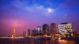 City skyline river boats night - a purple sky free wallpaper
