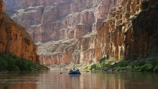 River canyon boat kayak cityscape - a man in a boat free wallpaper