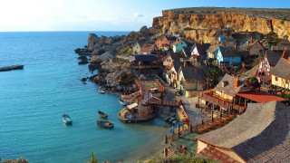 Cliffside village ocean boat castle - a small village free wallpaper